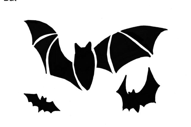 A black pumpkin stencil of bats 