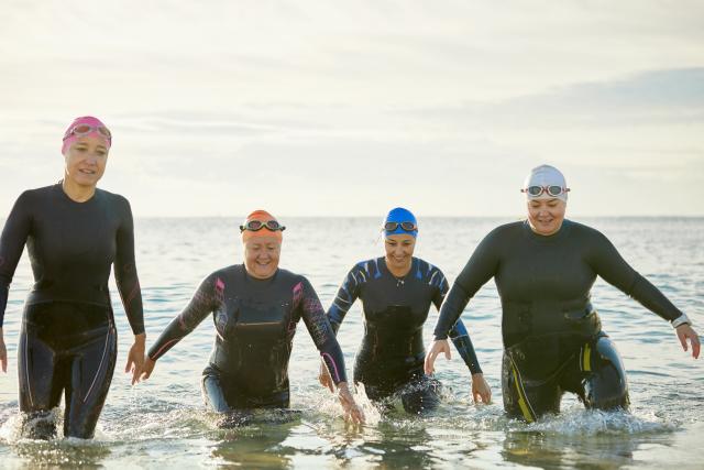 Four women coming out of the sea