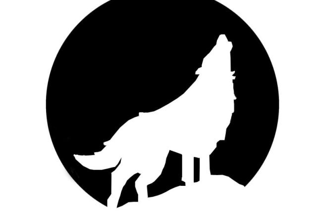 A black pumpkin stencil of a wolf