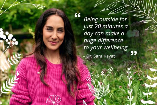 Dr Sara in pink jumper in garden with quote on nature