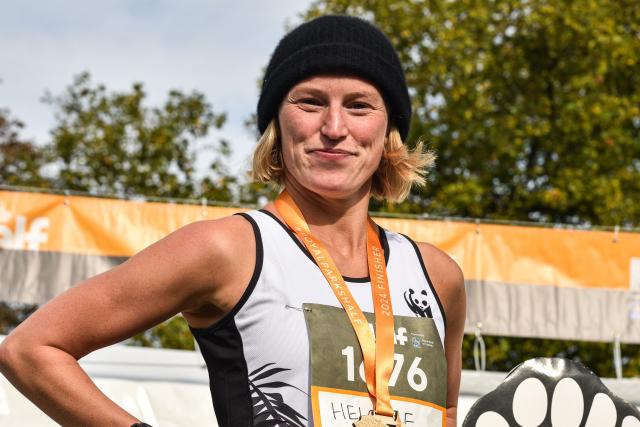 A WWF Royal Parks Half Marathon finisher with their medal.