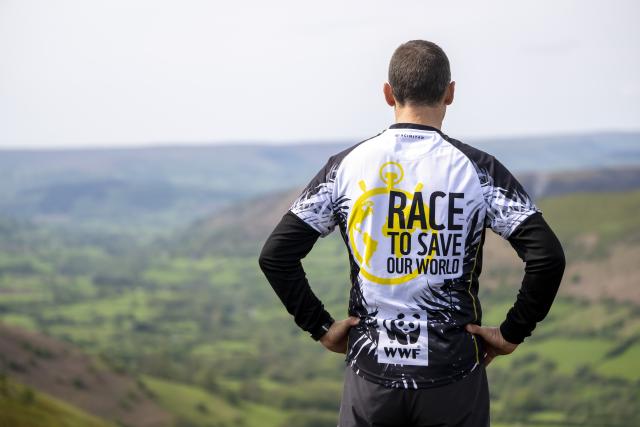 A WWF trekker looking out across a countryside view