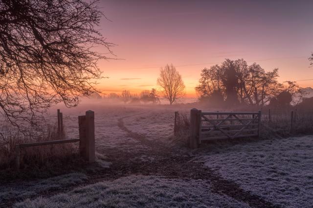 Cold, winter scene in Dedham, Colchester, UK. The frost is still covering the ground but the sun is trying hard to bring warmth to a cold, frosty morning.
