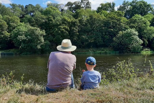 Grandpa and Grandson take a moment by a river Nottinghamshire