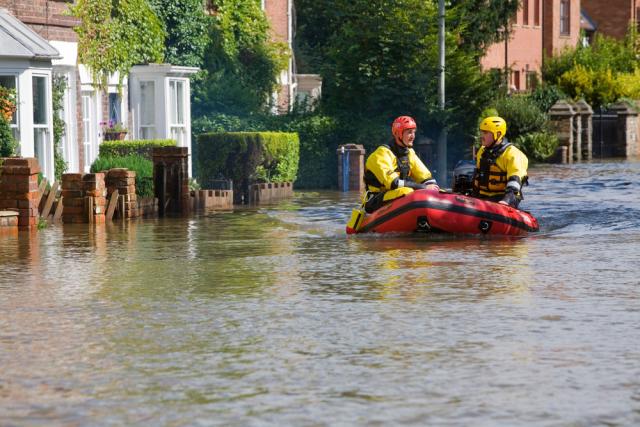 Rescue services entering Tewkesbury in an inflatable boat after severe flooding. Thousands of homes were inundated with people having to be evacuated, many by boat or by Sea King helicopter. The Myth water treatment plant in the town was also flooded, cutting off water supplies to around 350,000 people. 