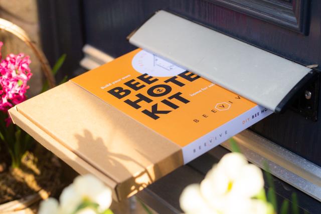 Bee hotel kit being posted through a letterbox