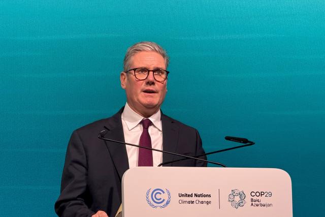 Keir Starmer at podium at COP29 climate talks press briefing