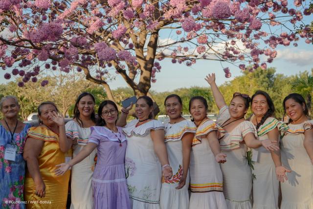 Women of Bolivia under a blossom tree