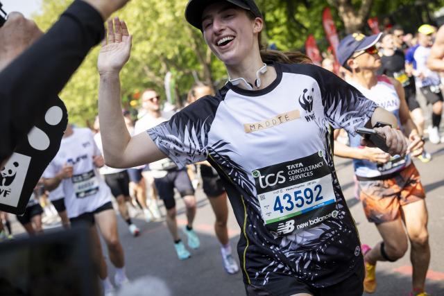 A WWF Runner smiling at the London Marathon
