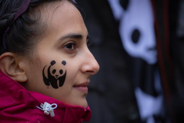 WWF Youth Ambassador Arielle with a ref jacket and WWF panda logo on her cheek