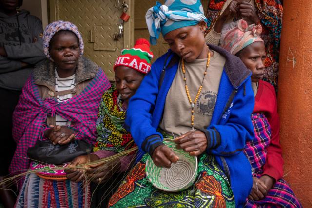 Scovia Kyarimpa, 37, weaves baskets alongside other members of the Nkuringo Women Artisan Group Bwindi Impenetrable National Par