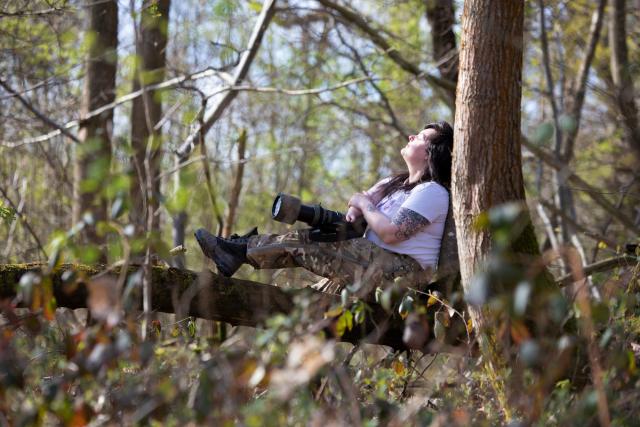 Jen Read, wildlife photographer, forest bathing and engaging her senses in ancient woodland. © Suzie Hubbard / WWF-UK