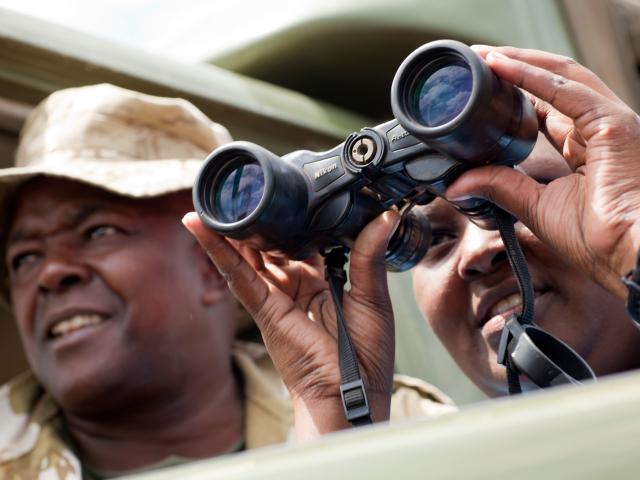 Rangers looking through binoculars