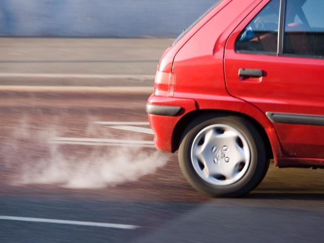 Red car exhaust and fumes