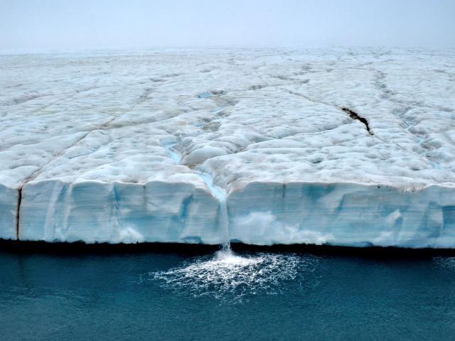 Waterfalls cascade from the Austfonna polar ice cap, Svalbard, Arctic