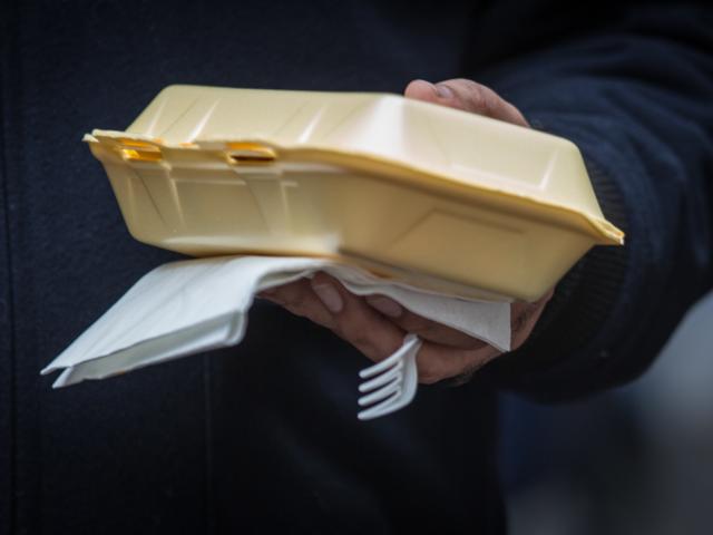 Disposable Plastic cutlery is used at a food market in London, England