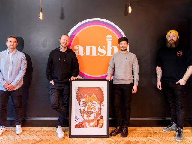 Nathan Wyburn reveals portait of Iwan Rheon at Ansh restaurant. 