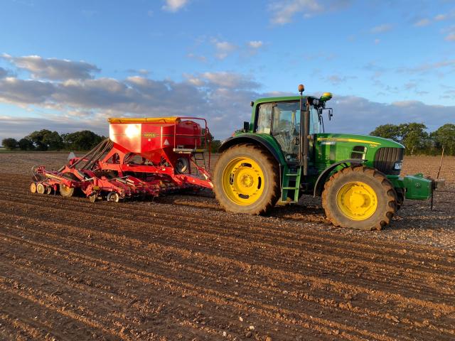 Tractor harvesting a field 