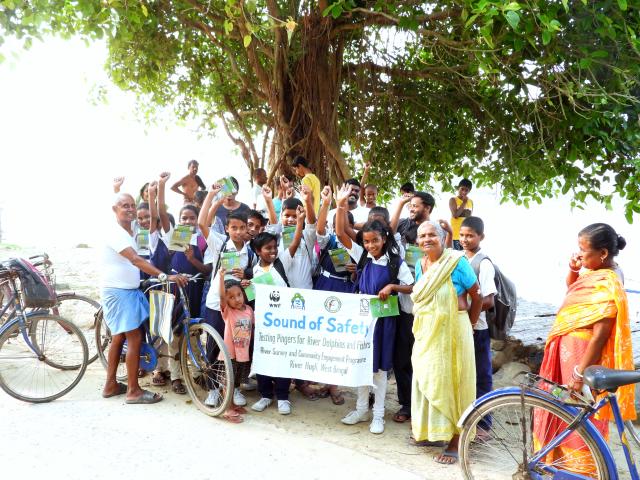 A group of school children in India holding a banner for 'Sound of safety' project