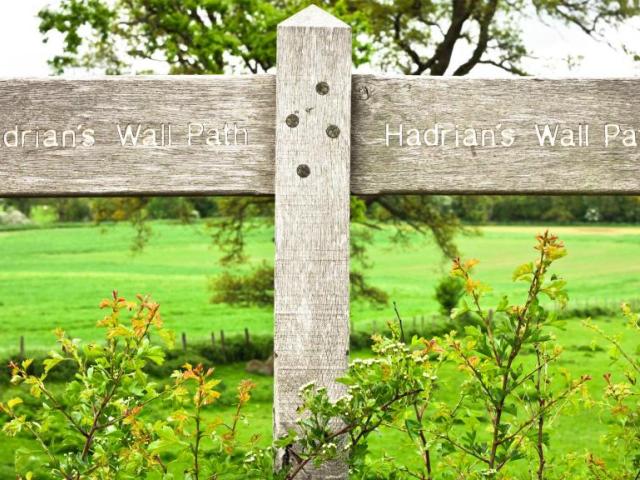 A signpost showing Hadrian's Wall Trail Path