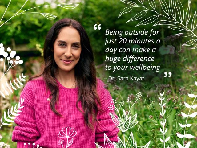 Dr Sara in pink jumper in garden with quote on nature