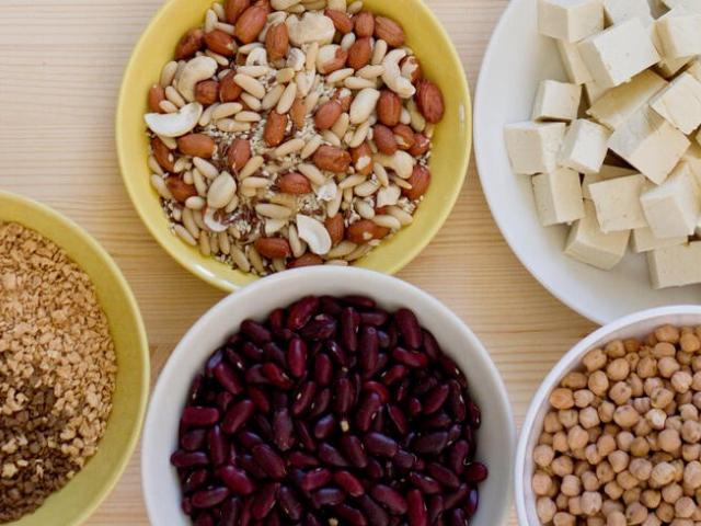 Bowls of nuts, tofu, beans, chickpeas and lentils