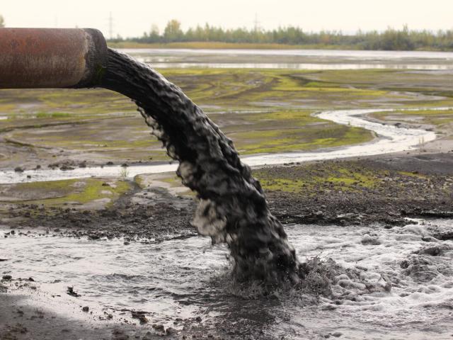 Dirty water discharged into river via a pipe