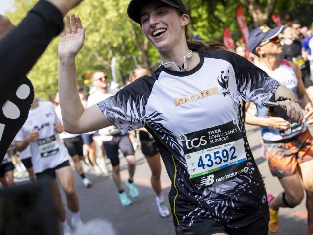 A WWF Runner smiling at the London Marathon