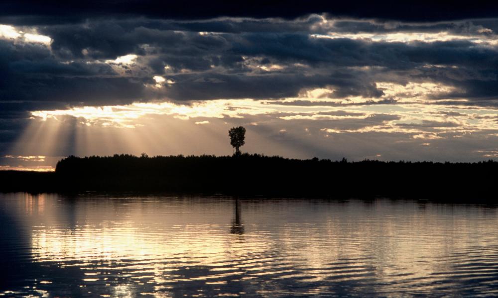 Sun shining through the clouds, Khingansky Zapovednik (Strict Nature Reserve), Amur floodplain. Far East.