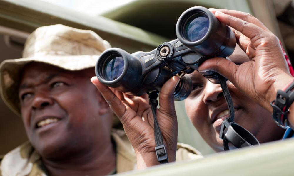 Rangers looking through binoculars