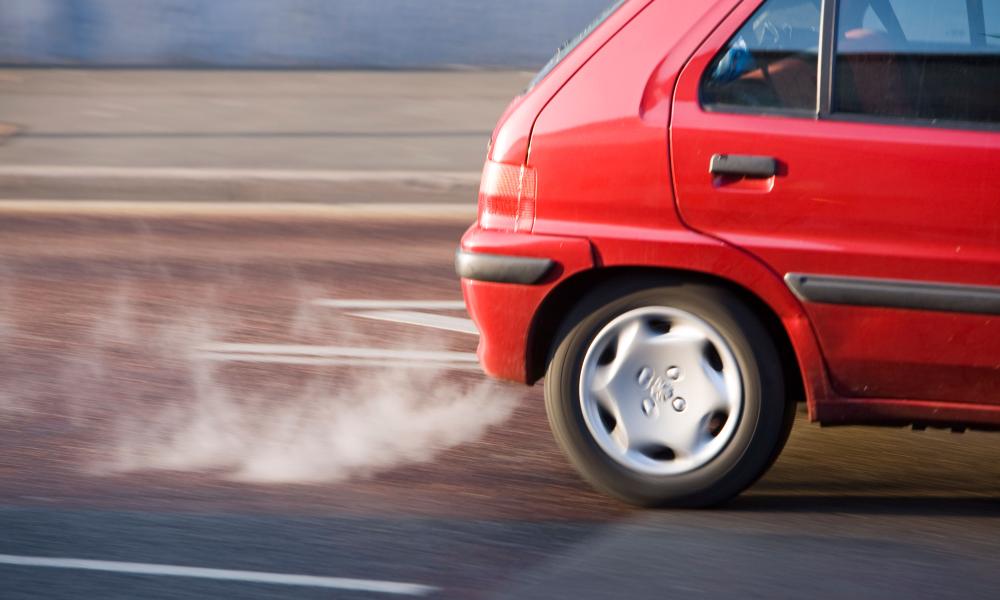 Red car exhaust and fumes