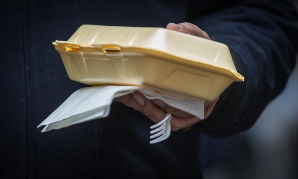 Disposable Plastic cutlery is used at a food market in London, England
