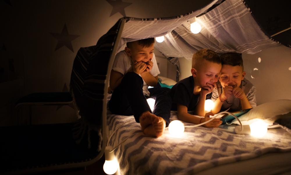Boys in a homemade tent