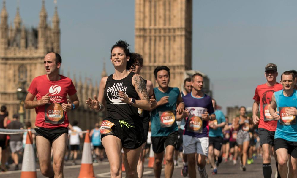Runners passing over Westminster Bridge with Elizabeth Tower in the background