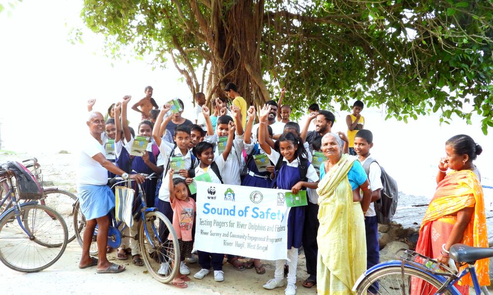 A group of school children in India holding a banner for 'Sound of safety' project