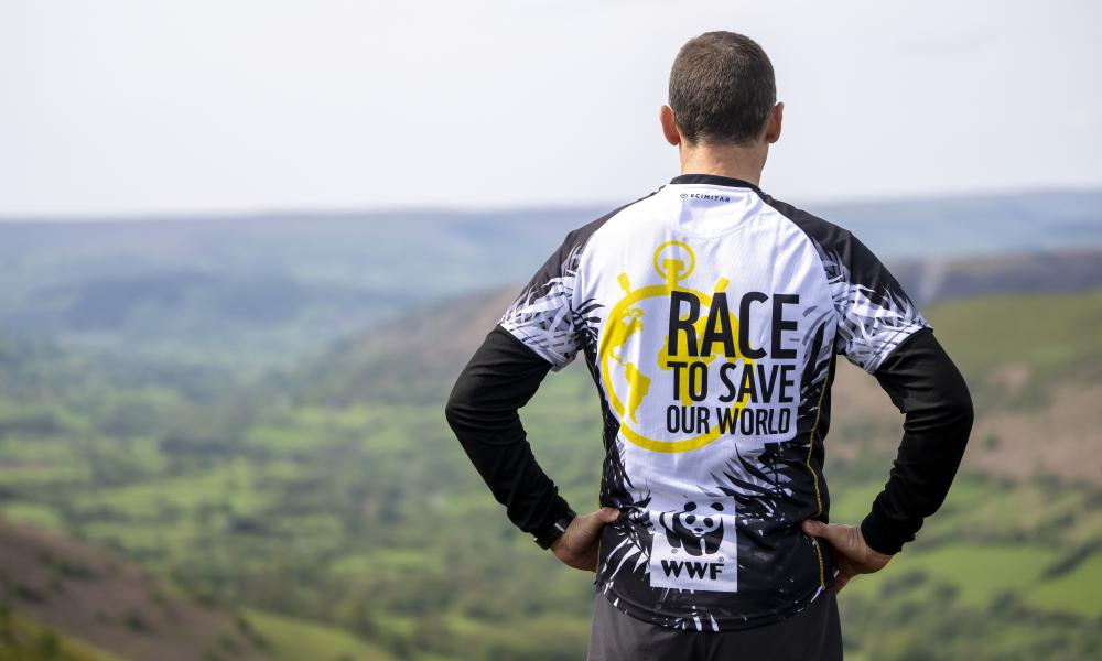 A WWF trekker looking out across a countryside view