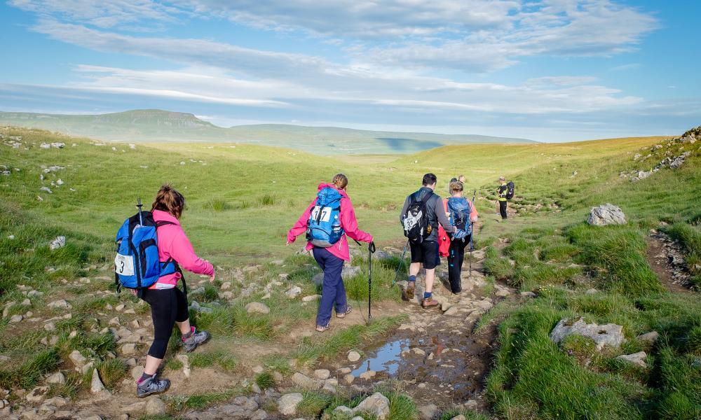 Hikers doing the Yorkshire Three Peaks challenge