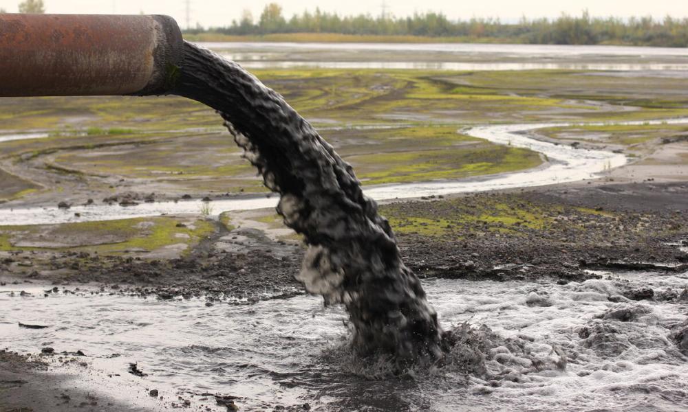 Dirty water discharged into river via a pipe