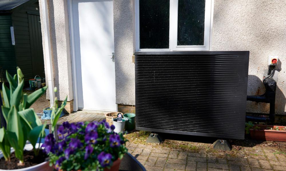 Daikin heat pump with flowers in the forefront of the image