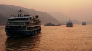 Boat sailing on the Yangtze River. The Yangtze is used a lot for people who go from one city to another. Chongqing Municipality. China