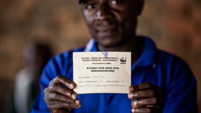 Individual record (pass book) for the Village Community Bank in Killimarondo, Tanzania - © James Morgan / WWF-US Individual record with pass book