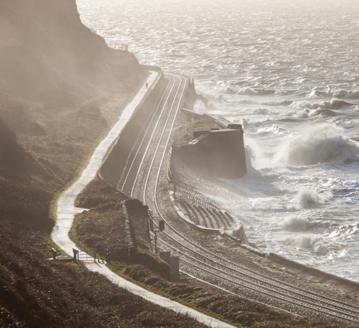 The west coast railway line near Workington in Cumbria, UK during a storm. The railway is very vulnerable to storm damage. 