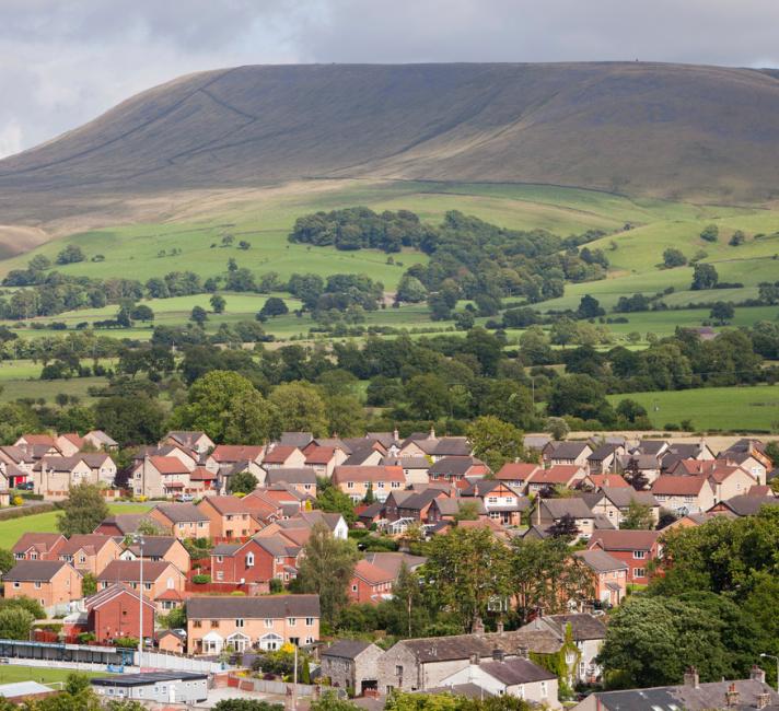 Houses on the outskirts of Clitheroe, Lancashire, UK, looking towards the surrounding countryside and Pendle Hill. Houses on the outskirts of Clitheroe, Lancashire, UK, looking towards the surrounding countryside and Pendle Hill.