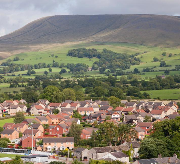 Houses on the outskirts of Clitheroe, Lancashire, UK, looking towards the surrounding countryside and Pendle Hill.