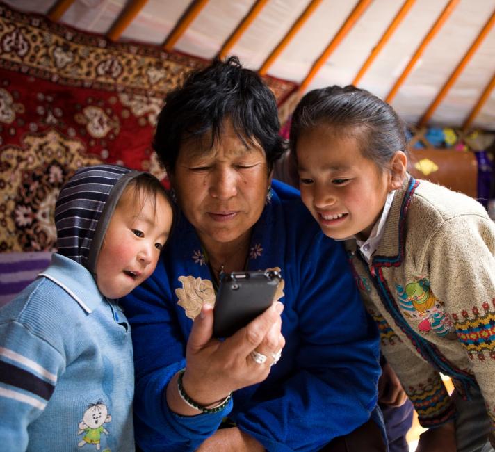 Nomadic herders using mobile phone