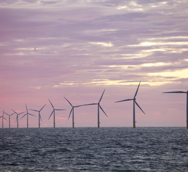 The Walney Offshore windfarm project, off Barrow in Furness, Cumbria, UK, at sunset. 