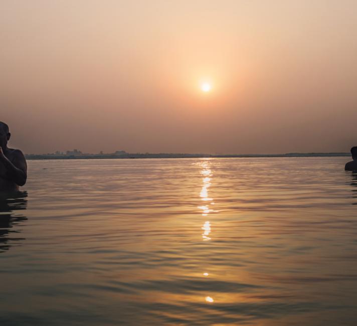 Men bathe in the Ganges River