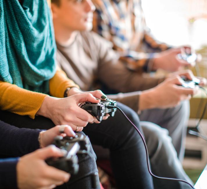 Friends playing a video game Friends playing a video game