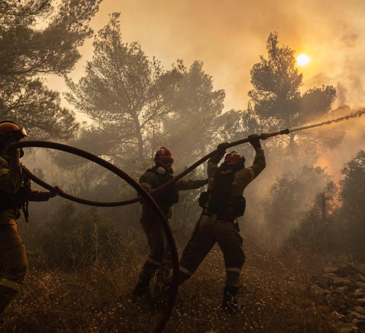 Firefighters battle a wildfire in Agia Sotira, a western suberb of Athens, Greece, on July 20, 2023.
