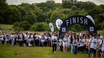 A large group of people, wearing WWF t-shirts. Taking part in the WWF Great Wild Walk.
